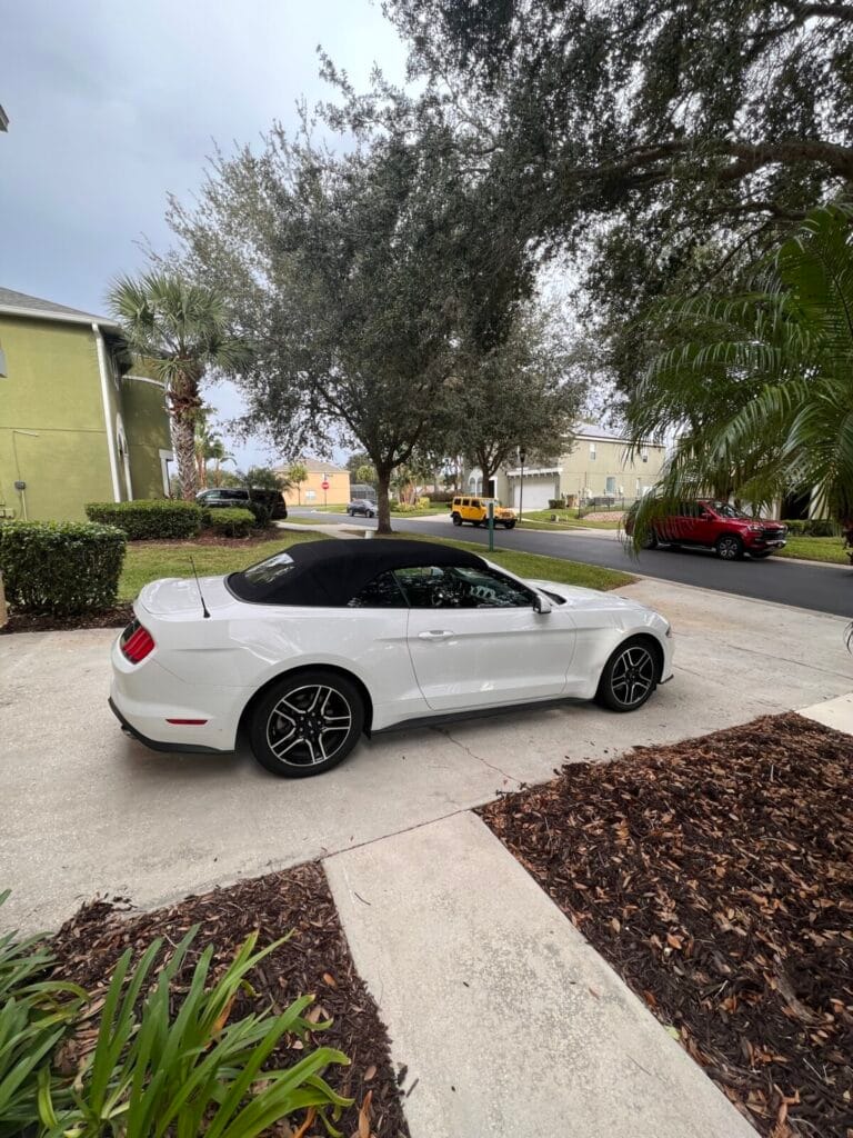 a white car parked on a driveway