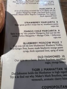 a menu with black text and white text