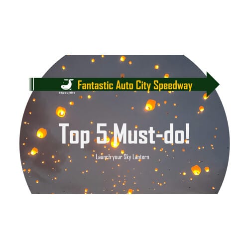 a group of orange lanterns in the sky