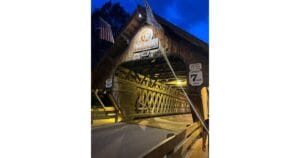 a wooden bridge with a flag