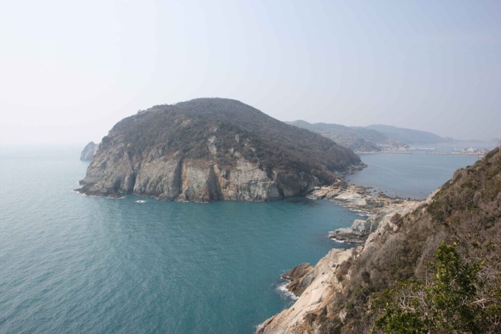 Serene coastal landscape with island -- Geomundo